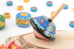 Handmade small blue wooden spinning top toy painted with eco dyes for children